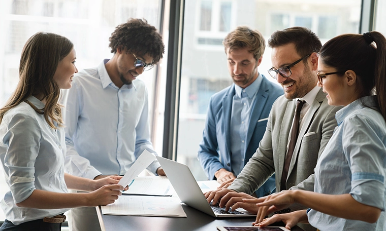 Portrait of successful business team working together in office.