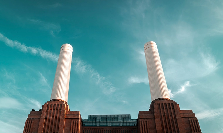 A large brick building with two tall white pillars.