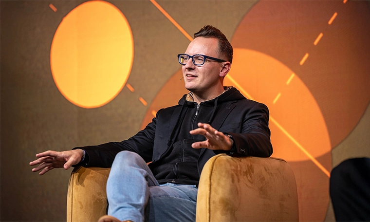 Dr Bernhard Kronfellner, Partner at Boston Consulting Group (BCG) at the London Blockchain Conference 2025 stage.